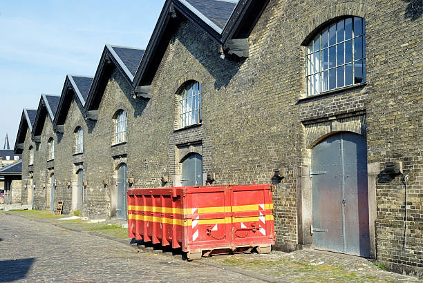 old factory building and red container